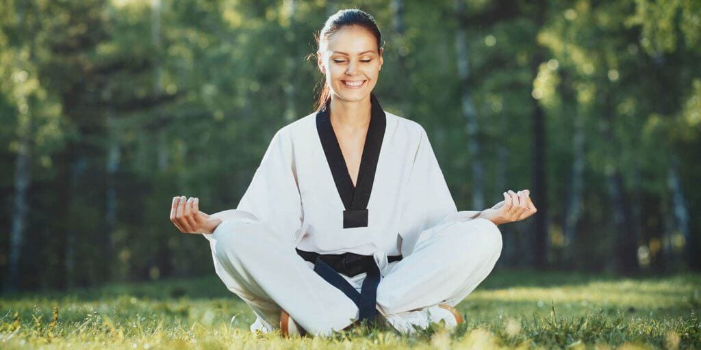 Martial Arts Lessons for Adults in _Naugatuck_ CT - Happy Woman Meditated Sitting Background